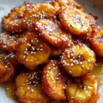 takeout style fried banana fritters with honey drizzle sesame